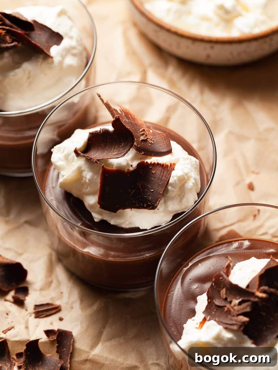 gluten free egg free chocolate pudding topped with whipped cream and chocolate shavings