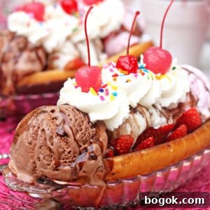 Donut Trifle Dessert: Layered Mini Trifles with Glazed Donuts 3 Close up of a Doughnut Ice Cream Sundae with whipped cream and cherries on top.