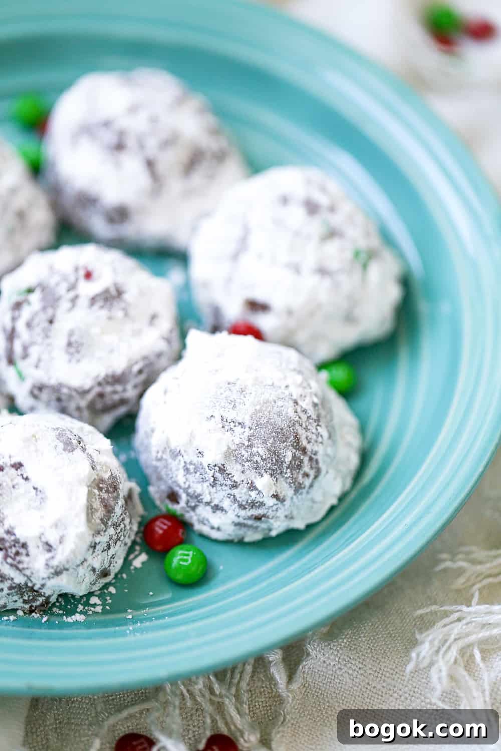 Decadent Chocolate Snowball Cookies: Melt-in-Your-Mouth Recipe 2 best Chocolate Snowball Cookies recipe with festive m&ms and powdered sugar