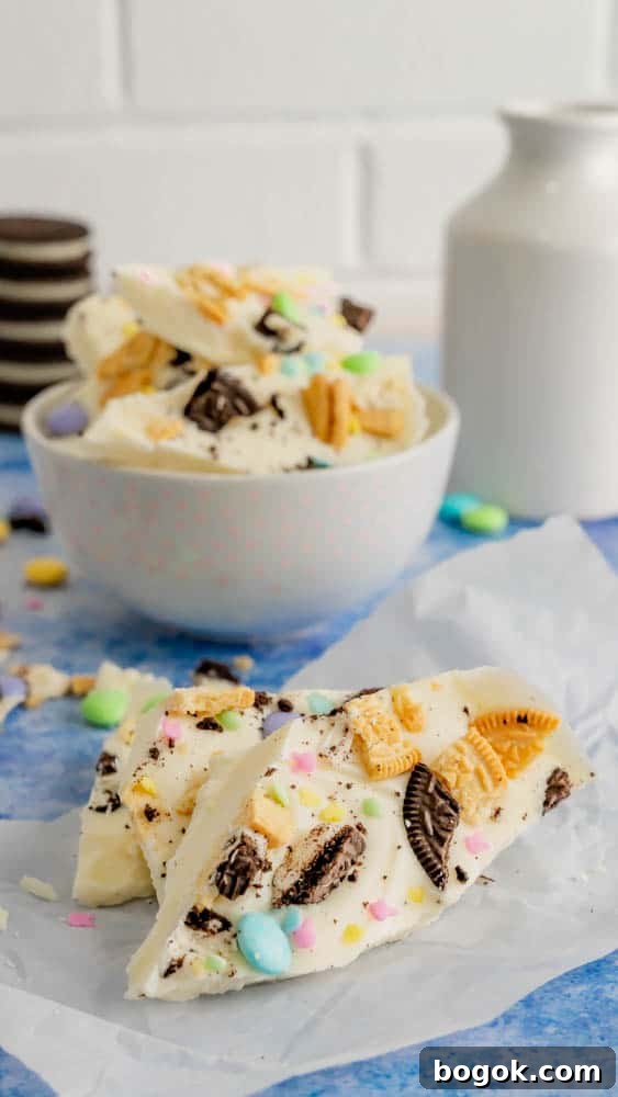 Broken Easter Bark on parchment paper with a bowl of bark in the background.