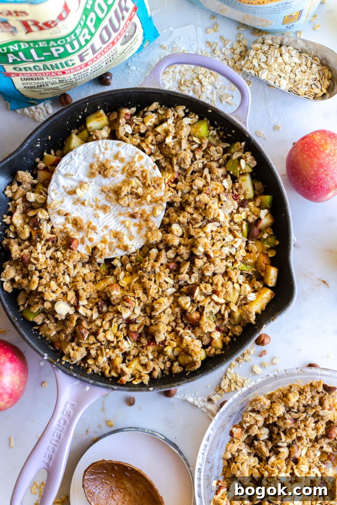 Brie and Apples getting topped with hazelnut crisp