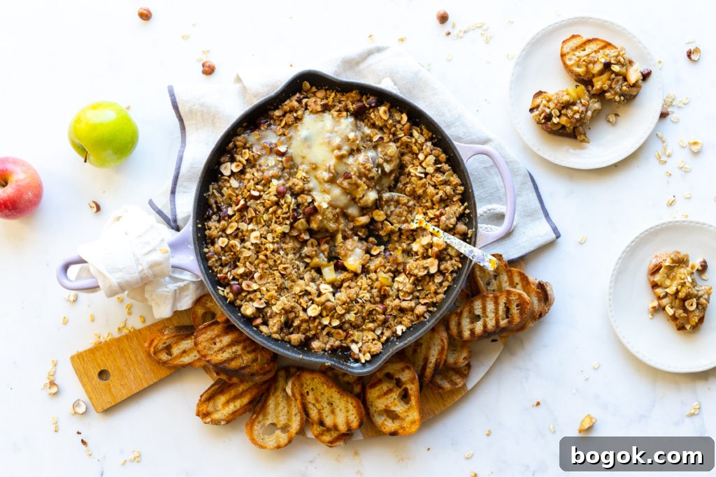 Snuggle in with the cozy comfort of this Baked Brie Apple Crisp.