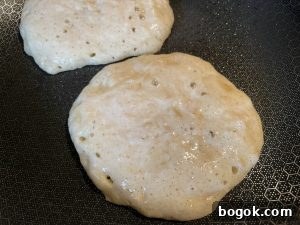 Banana sourdough pancakes ready to flip.