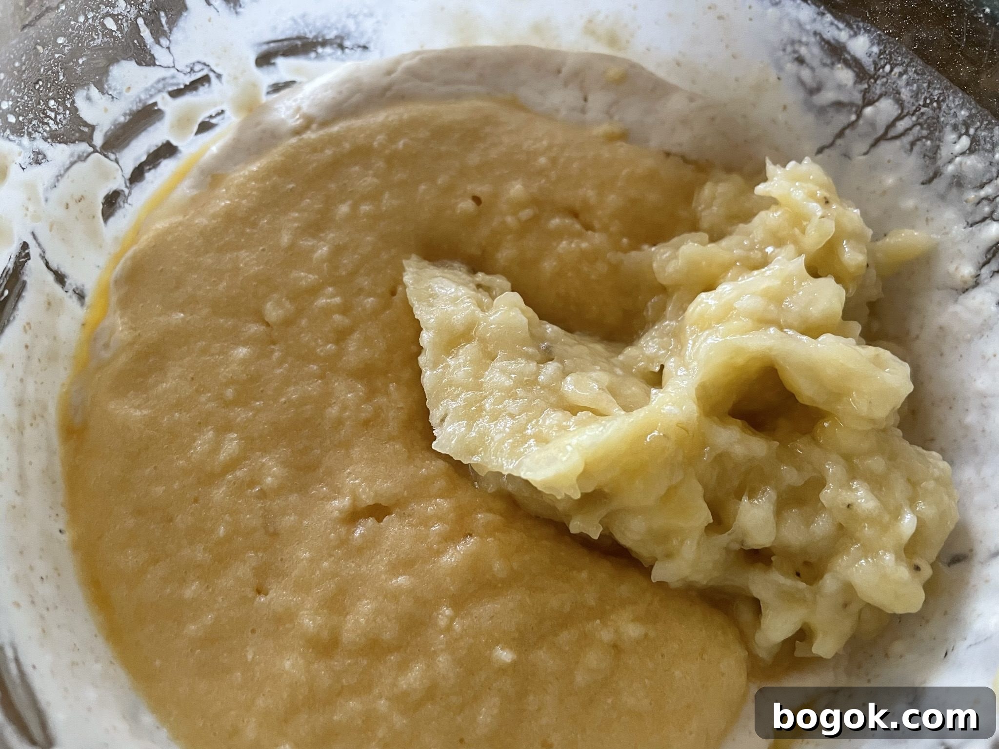 Fold in mashed banana and egg mixture into levain batter