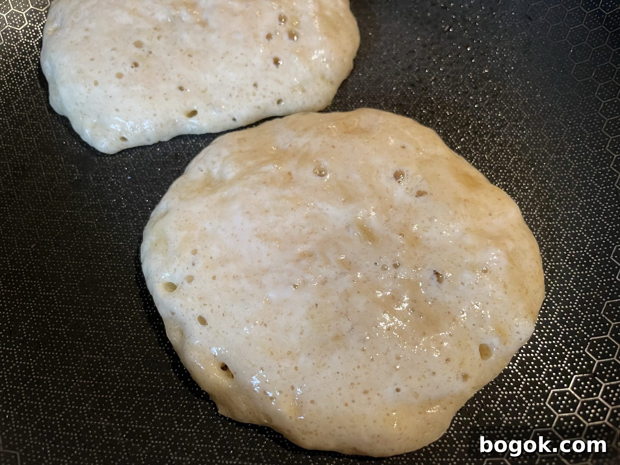 Banana sourdough pancakes ready to flip.