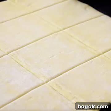 Puff pastry sheet cut into squares.