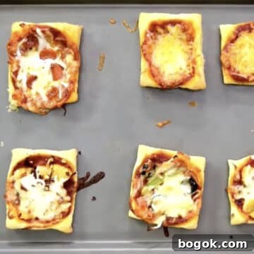 Baked puffs on gray metal tray.