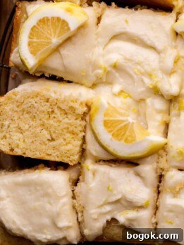 Lemon drizzle cake on a platter.