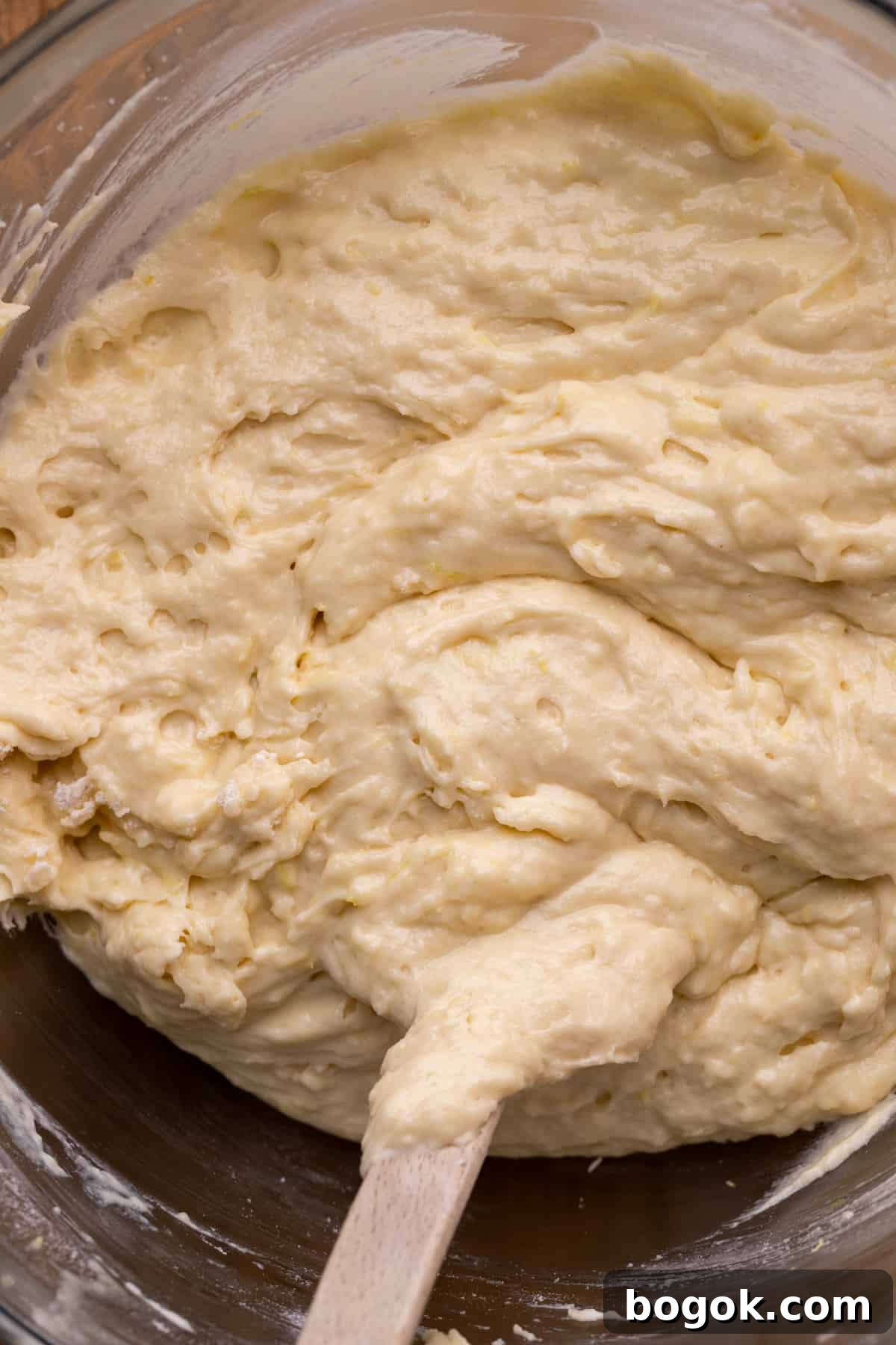 Lemon cake batter in a glass bowl.