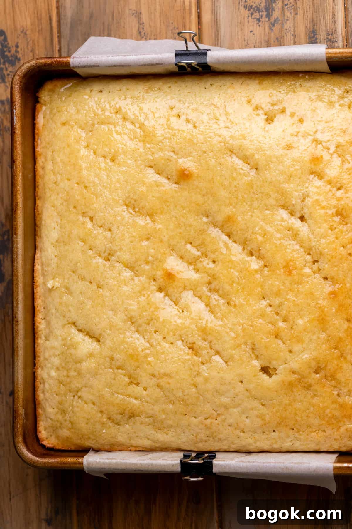 Baked cake with the lemon syrup poked in.