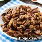 Sweet-and-Spicy Candied Pecans Recipe for Air Fryer 5 Candied Pecans on a plate.