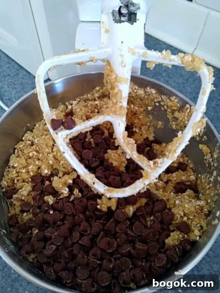Amish Oatmeal Chocolate Chip Bars Recipe — Chewy, Old-Fashioned Treat 3 mixing oatmeal chocolate chip cookie bar dough in my Kitchen Aid.