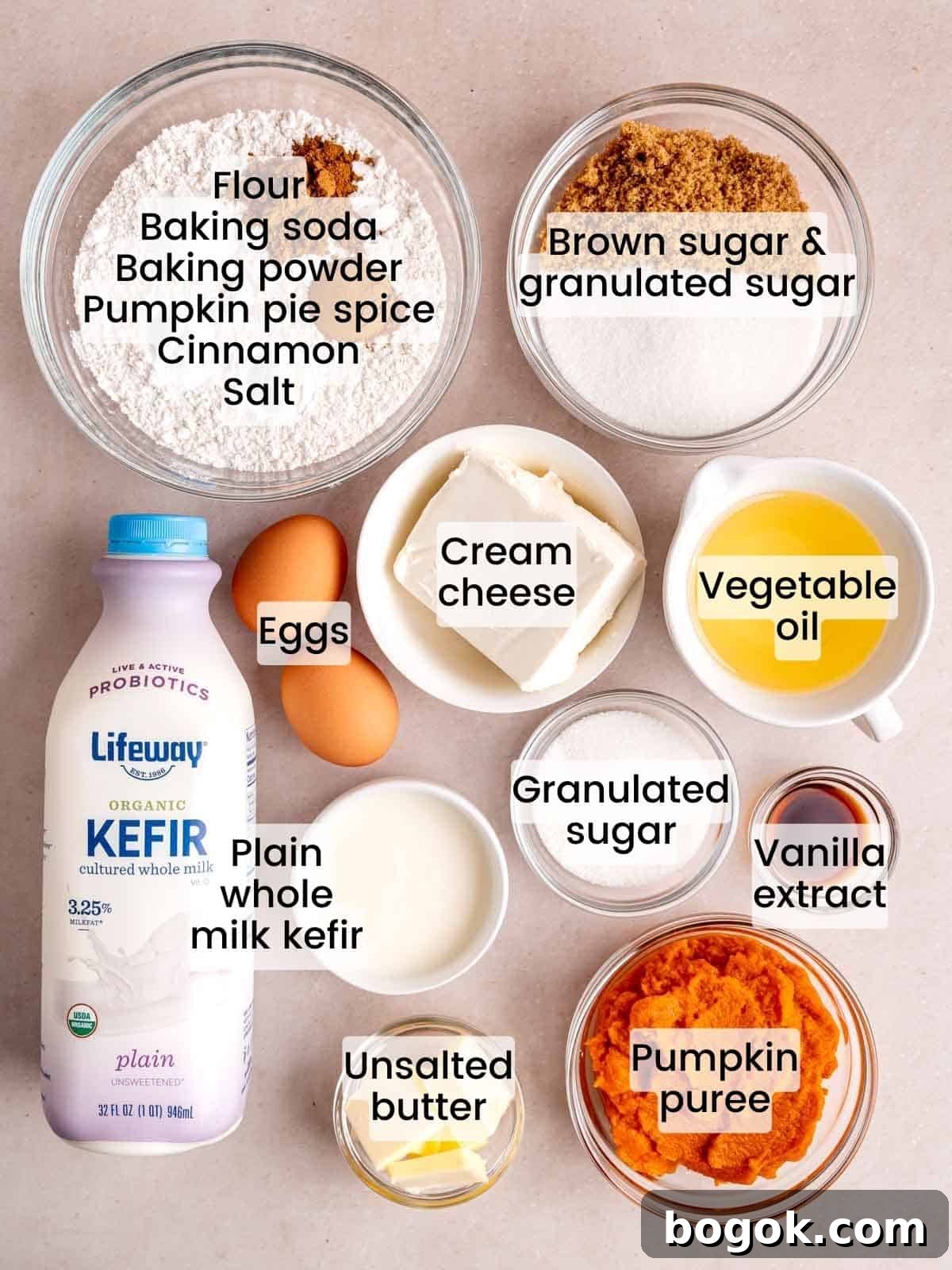 Ingredients needed to make pumpkin muffins with cream cheese and streusel.