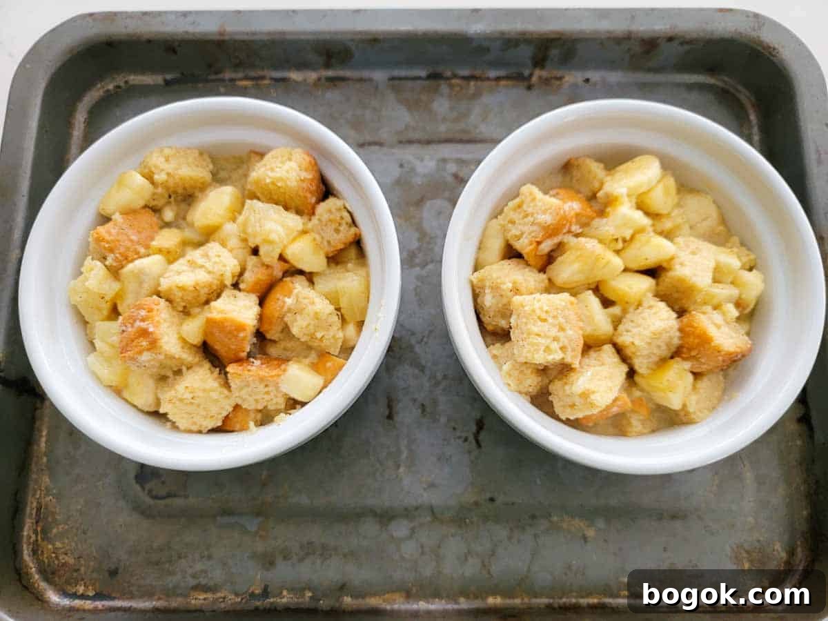 Pineapple Banana Bread Pudding Recipe for Moist, Fruity Dessert 6 banana pineapple bread pudding batter poured into two 10 ounce ramekins.