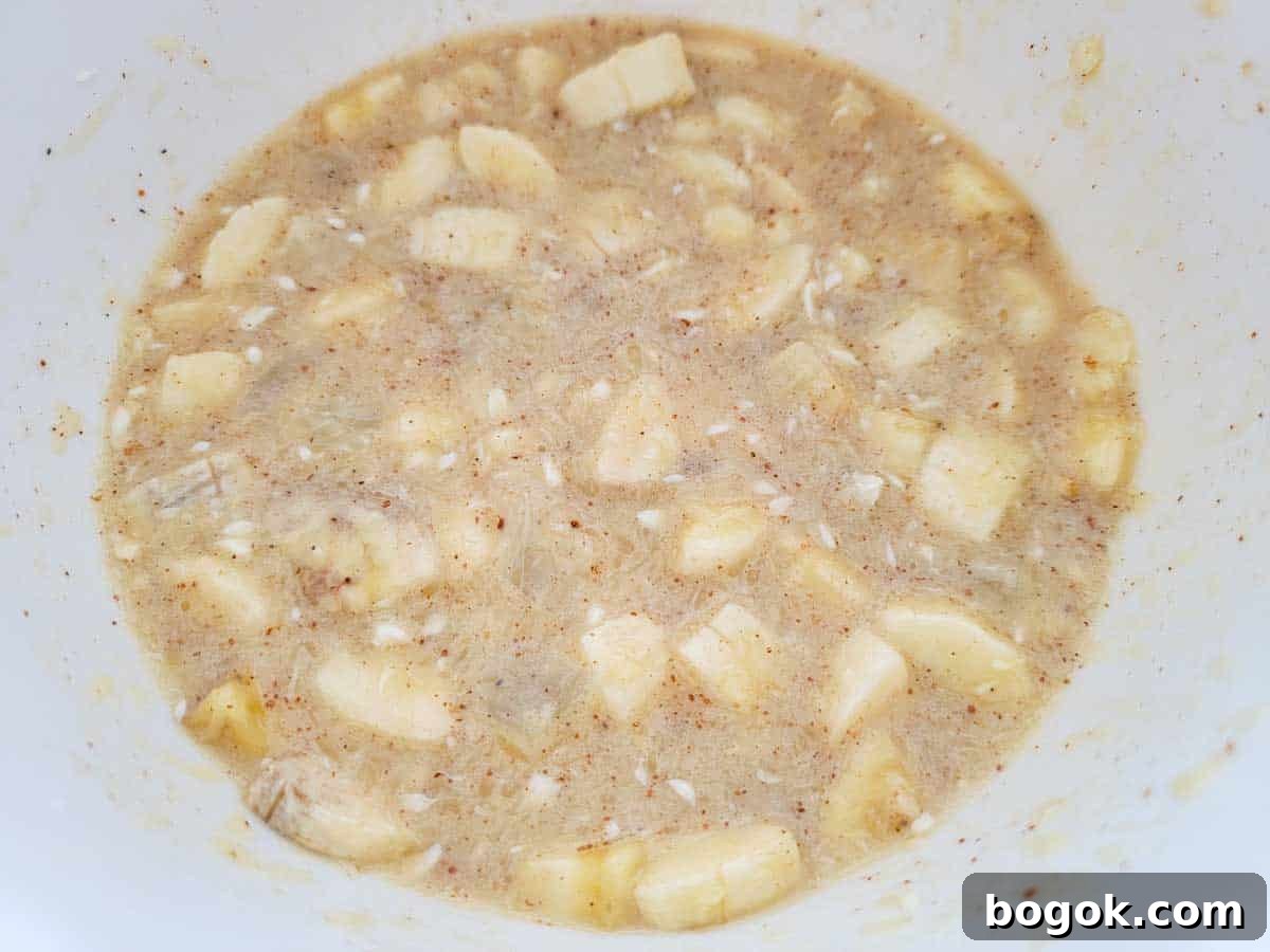 Pineapple Banana Bread Pudding Recipe for Moist, Fruity Dessert 5 diced banana and pineapple added to batter mixture.
