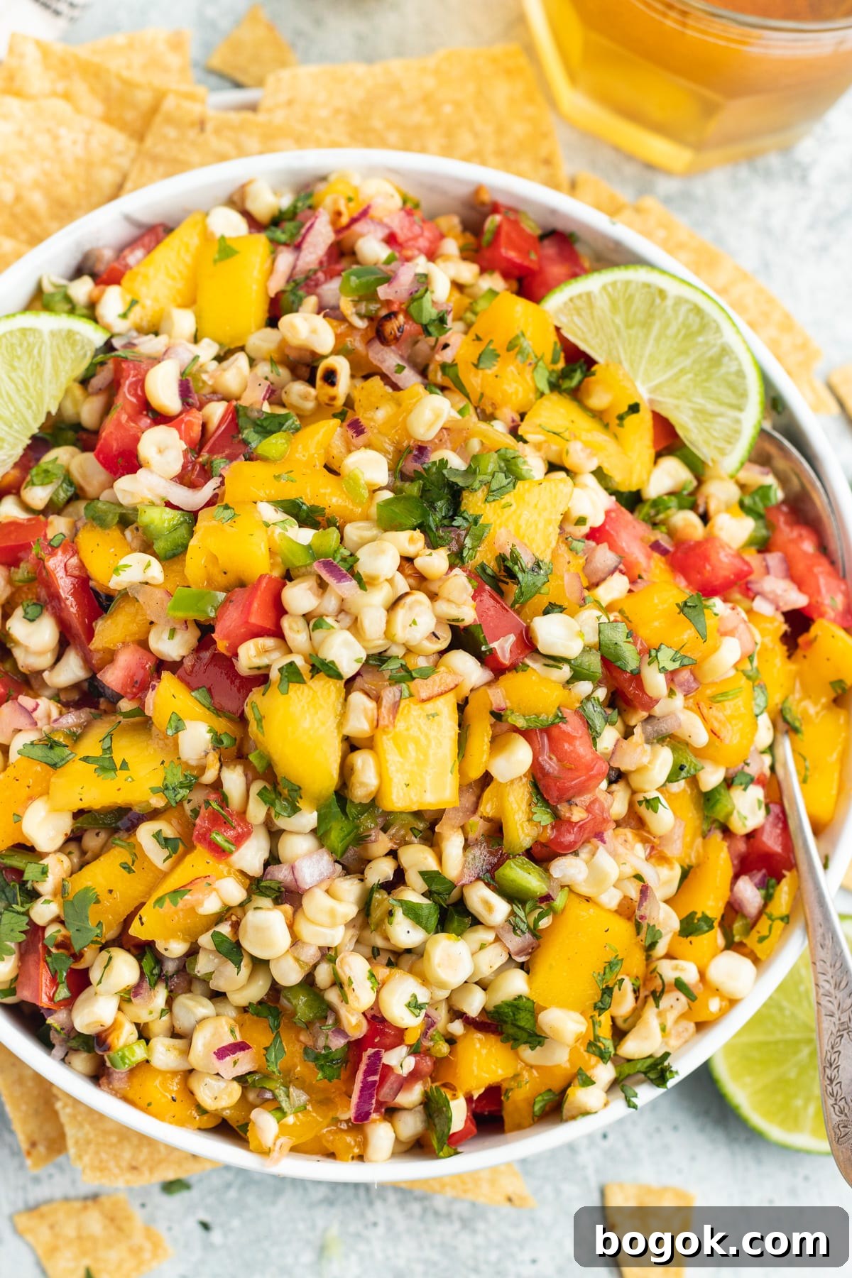 Mango Grilled Corn Salsa Recipe for Summer Parties and BBQs 2 Picture of a bowl filled with mango and grilled corn salsa.