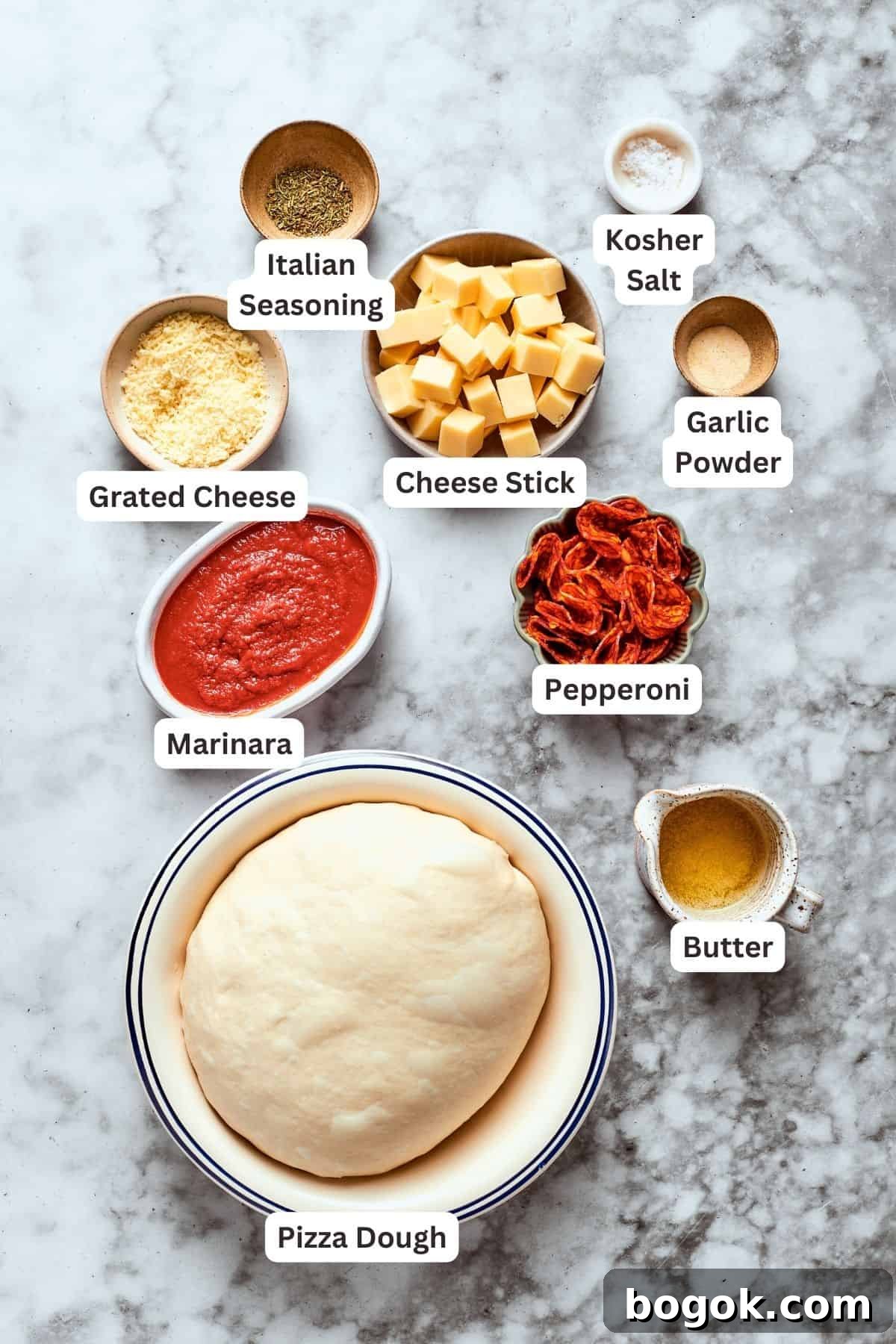 Ingredients for pizza bites are labeled and portioned out.
