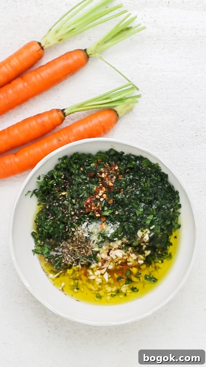 The ingredients of a chimichurri shown being added to a small dish.