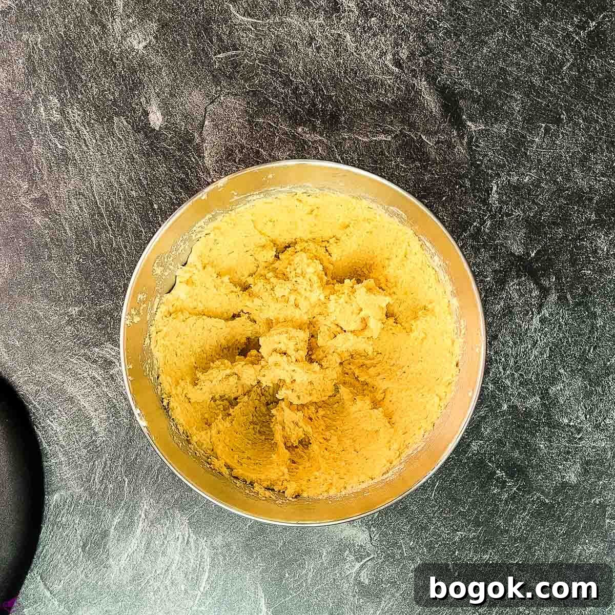 Combine mascarpone, butter, eggnog, vodka, and ladyfinger crumbs to a sticky dough.