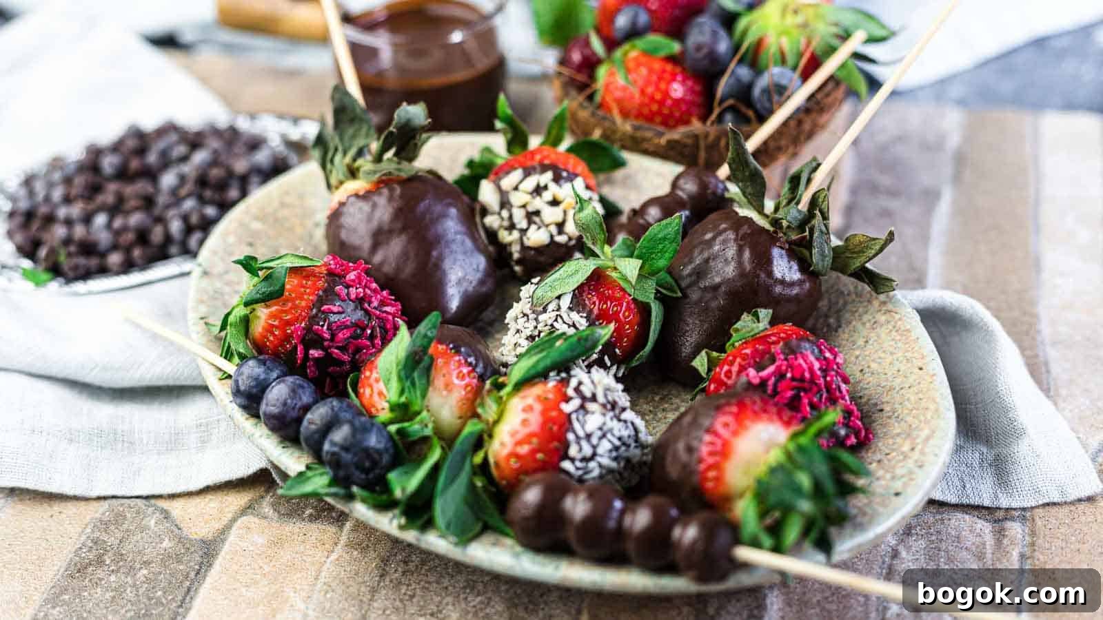 Chocolate Covered Strawberries and berries on a plate.