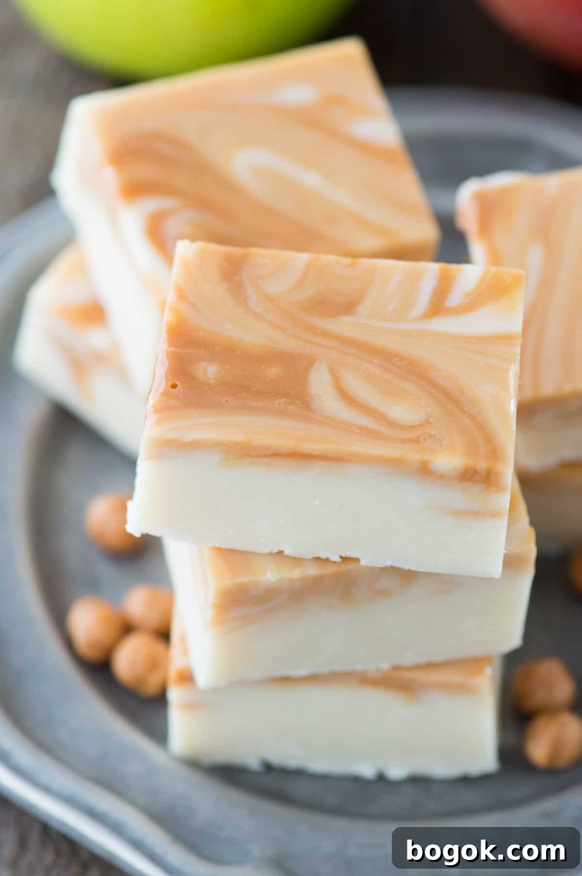 Salted Caramel Apple Fudge Recipe for Fall Treats 4 pieces of caramel apple fudge on metal plate