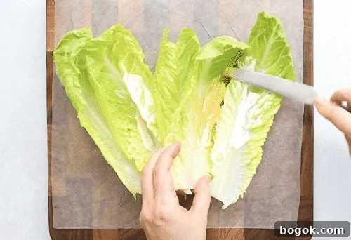 overhead view of lettuce wrap on a wooden board