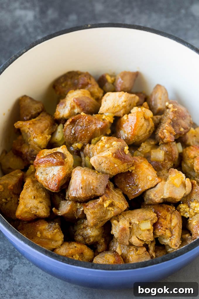 Cubes of pork cooked to a golden brown. Cubes of pork cooked to a golden brown.