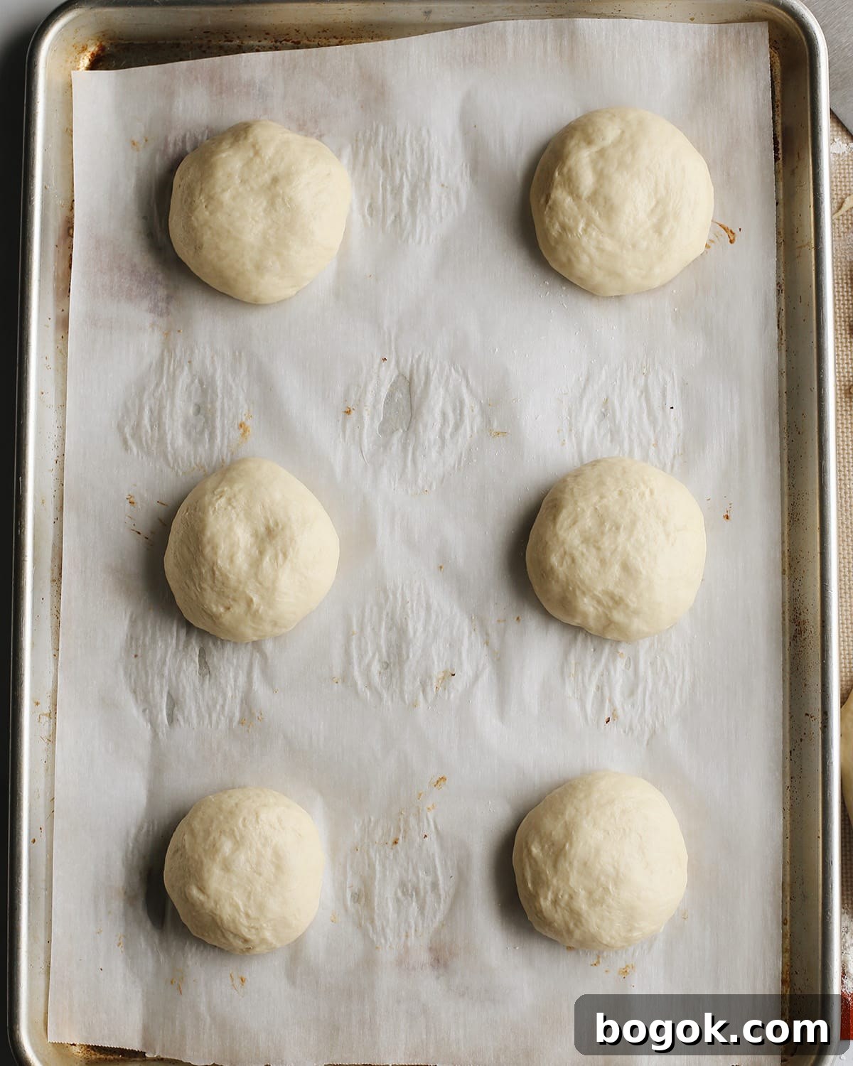 How to Make Homemade Hamburger Buns - buns rising on baking sheet