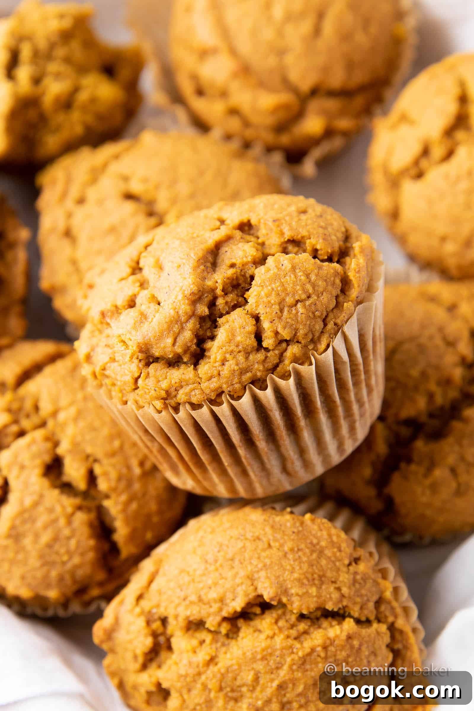 Vegan Pumpkin Muffins: this vegan pumpkin muffin recipe is easy & eggless! The best vegan pumpkin muffins – moist, soft & tender crumb, perfectly spiced. #Vegan #Pumpkin #Muffins #Fall | Recipe at BeamingBaker.com
