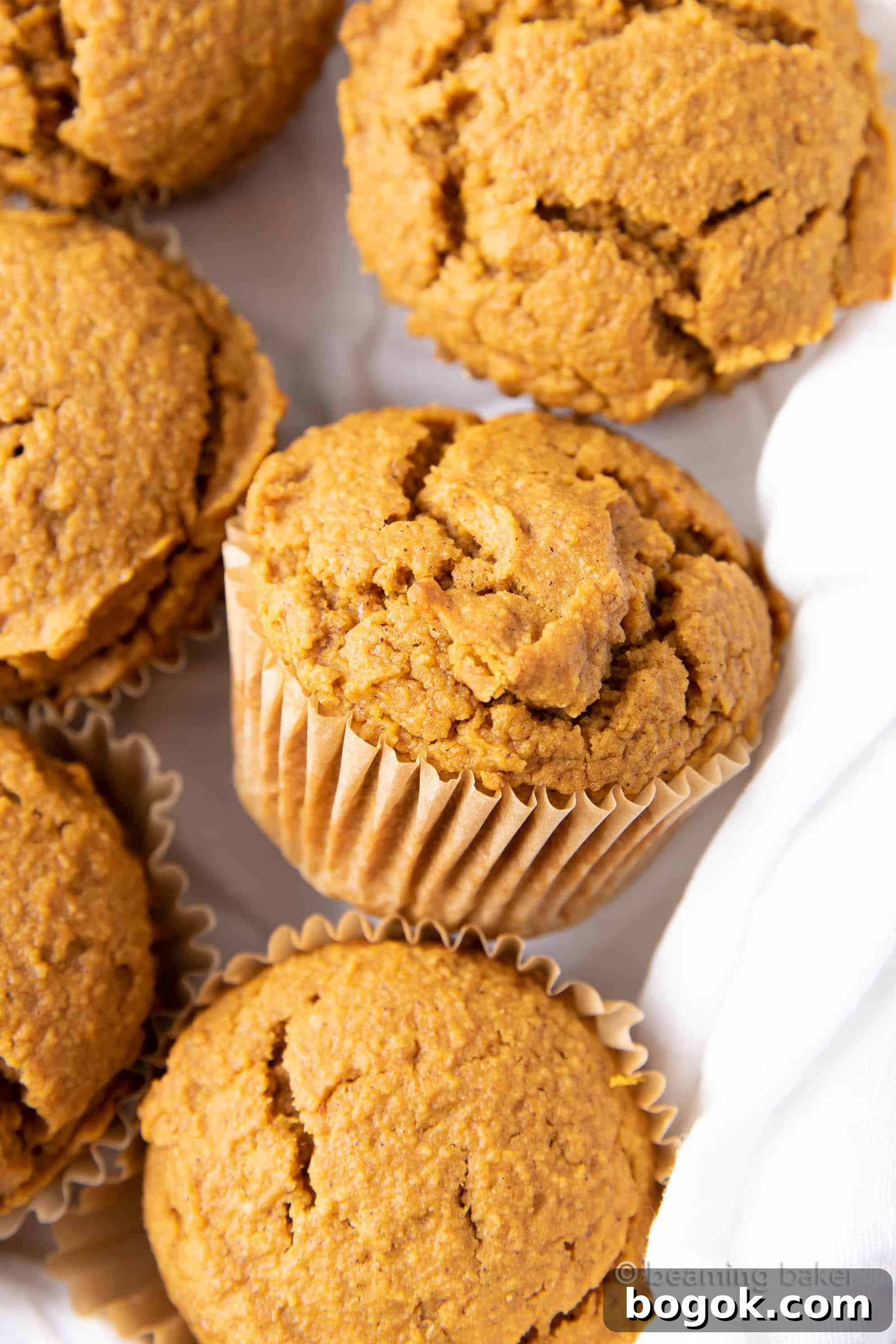 Vegan Pumpkin Muffins: this vegan pumpkin muffin recipe is easy & eggless! The best vegan pumpkin muffins – moist, soft & tender crumb, perfectly spiced. #Vegan #Pumpkin #Muffins #Fall | Recipe at BeamingBaker.com