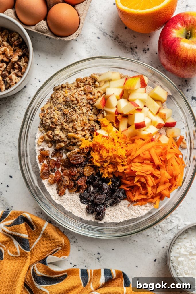 This jumbo morning glory muffins recipe with fruity and nutty add-ins is packed with warm spices for the perfect breakfast bite. Dry ingredients for the muffins in a bowl.