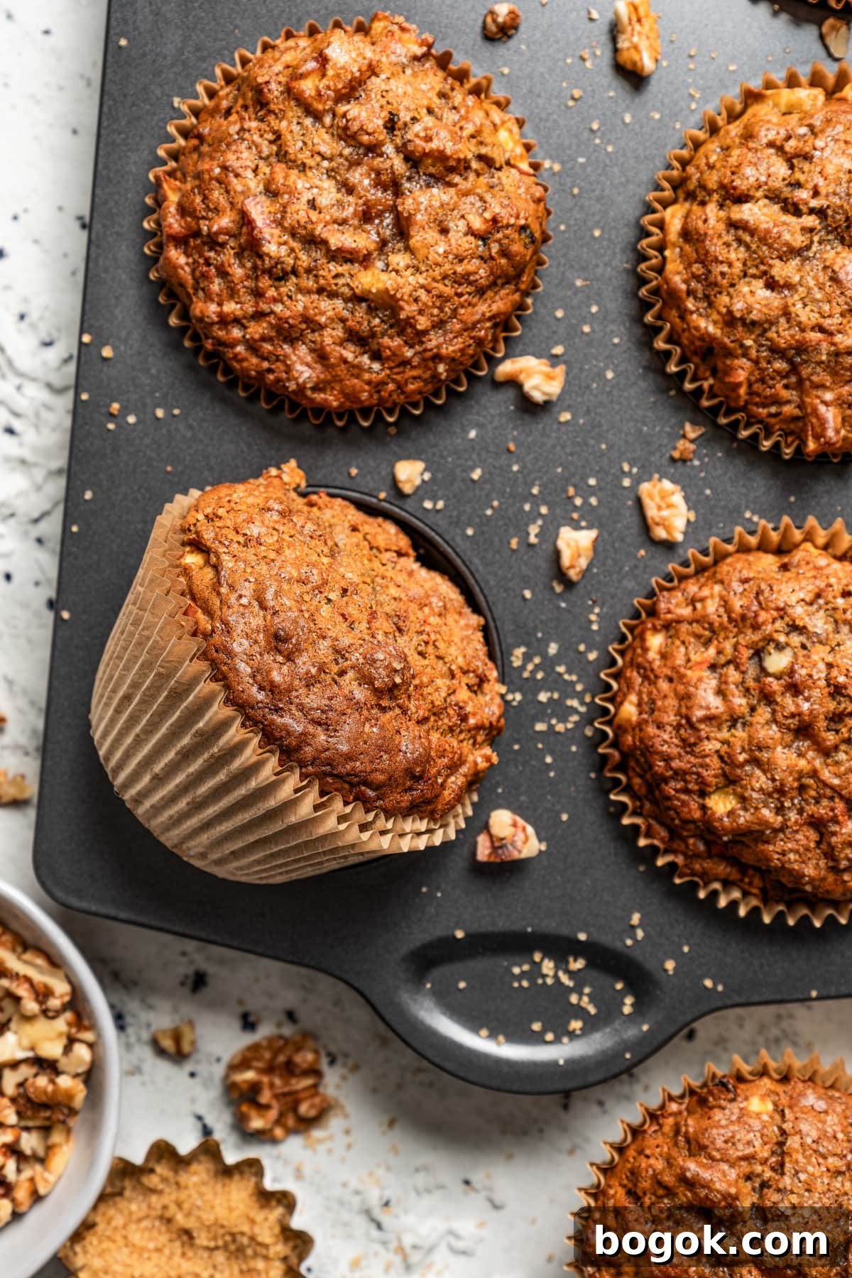 Moist Morning Glory Muffins with Carrots, Apples & Coconut 2 Overhead shot of a muffin pan with muffins.