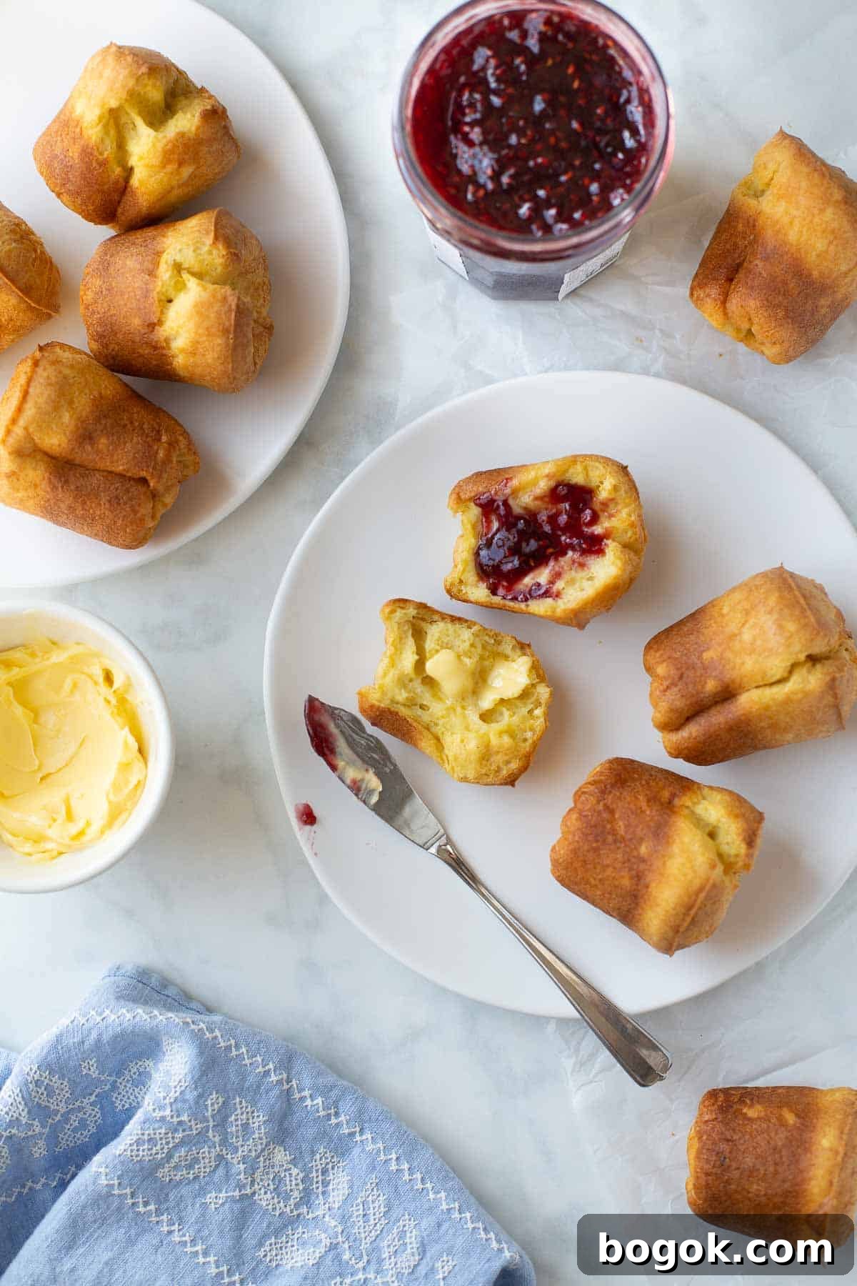 overhead shot of popovers served with butter and jam.