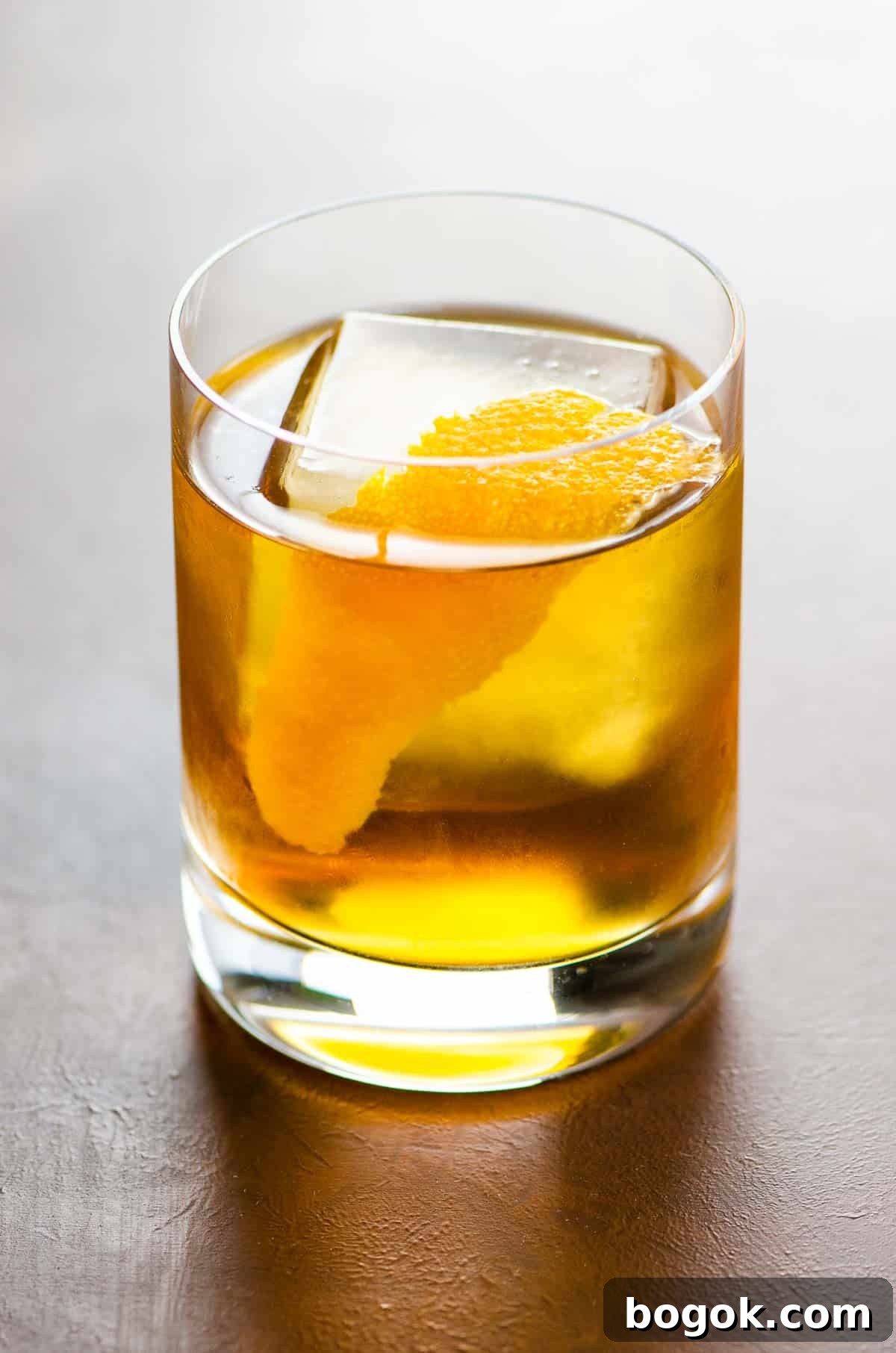 The Corduroy rye and cardamaro cocktail in a rocks glass garnished with an orange twist