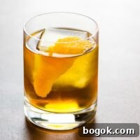 The Corduroy rye and cardamaro cocktail in a rocks glass garnished with an orange twist