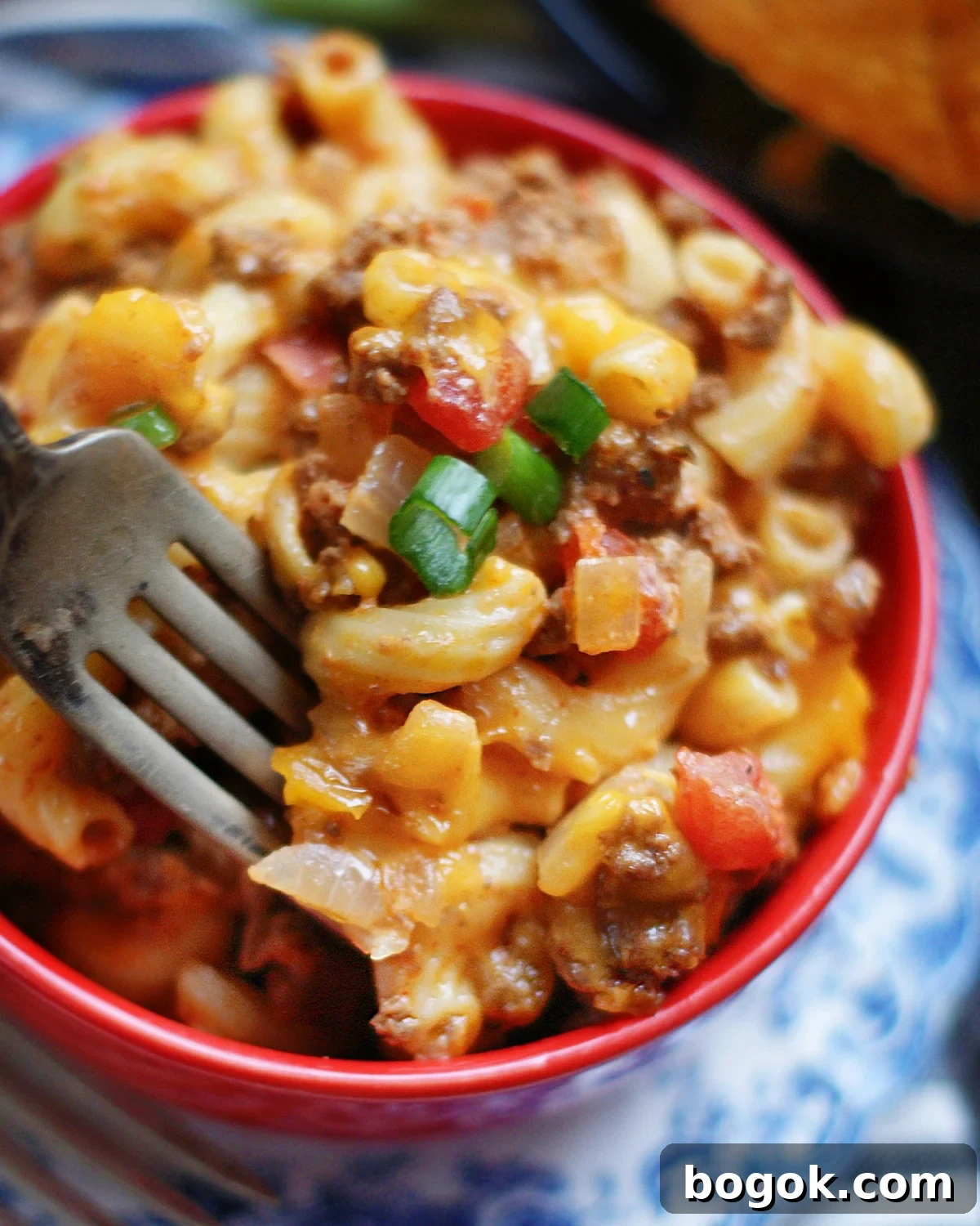 A serving of the best Chili Mac recipe made on the stove top & finished under the broiler in less than 30 minutes.
