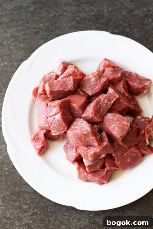 Chopped steak on a white plate.