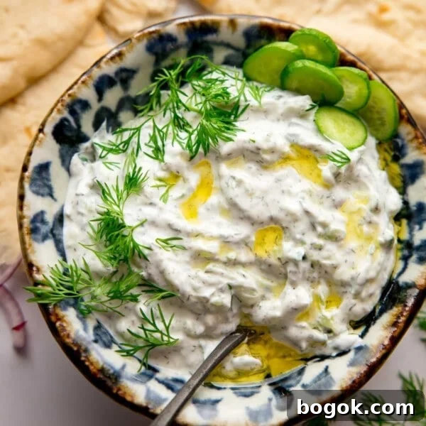 Bowl of Tzatziki with a spoon in