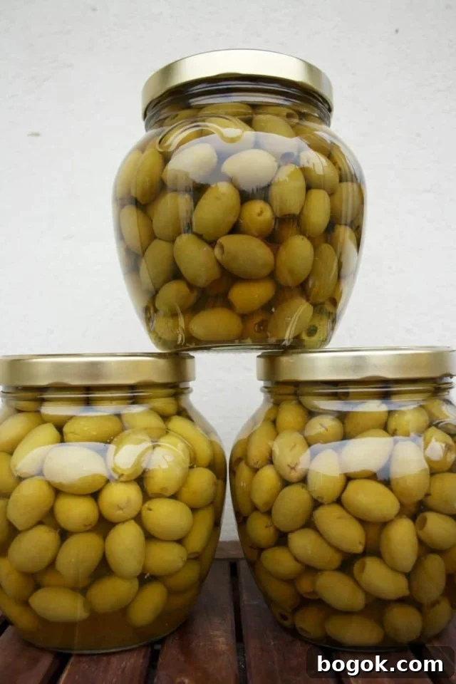 Olive Tapenade - Green Olives in Three Jars on Top of One Another