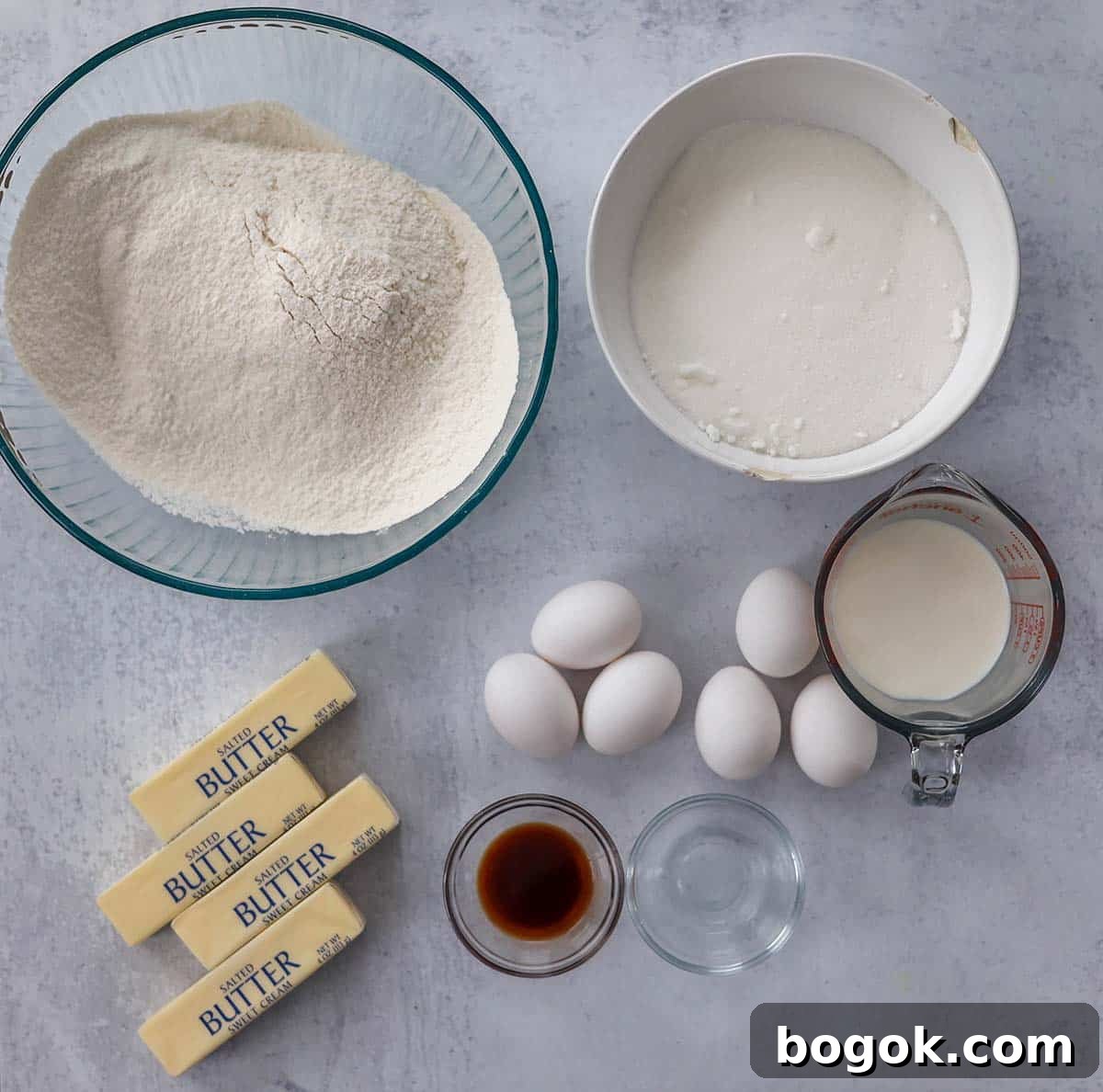 sugar, flour, eggs, butter, milk, vanilla extract, and almond extract.