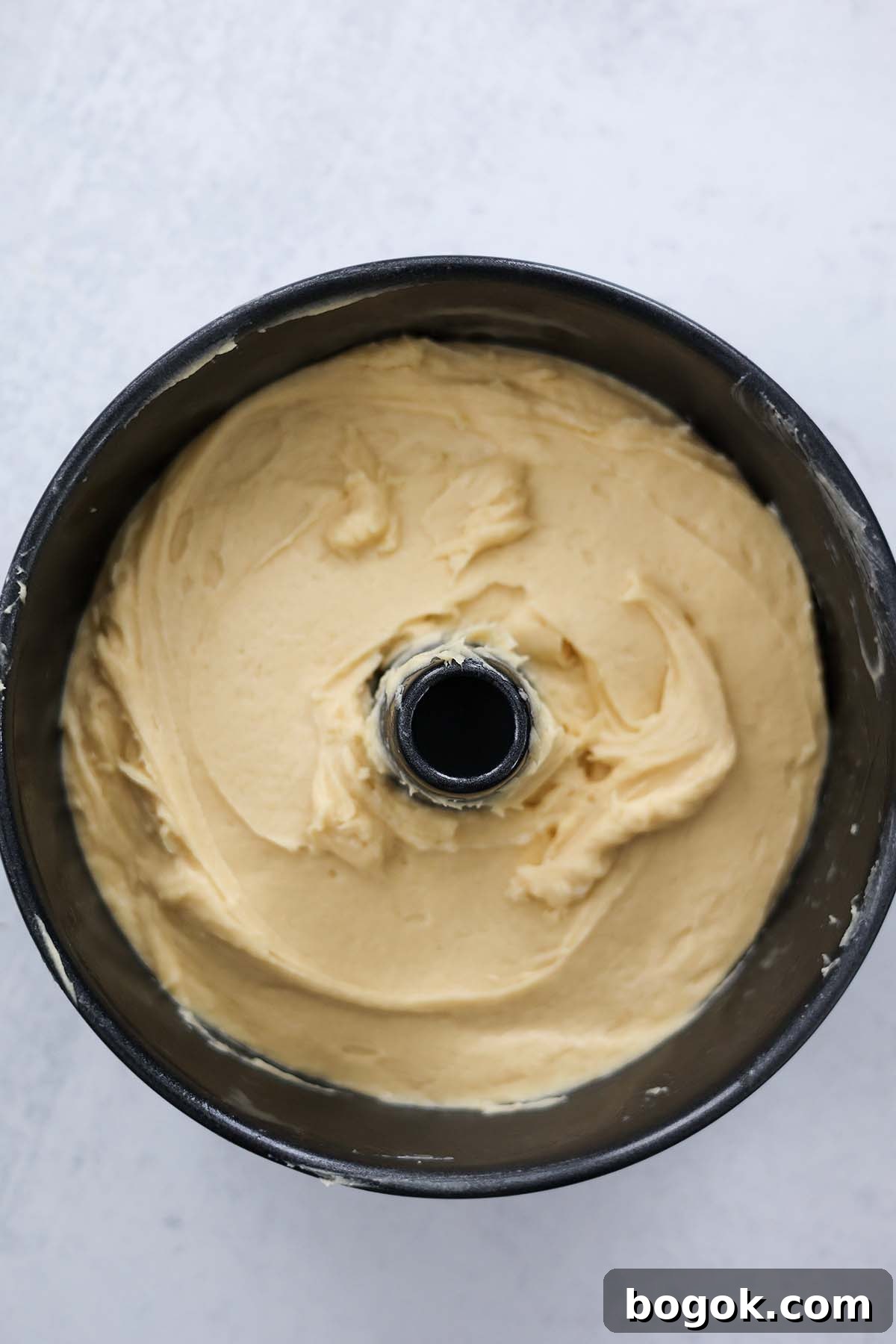 cake batter in a tube pan.