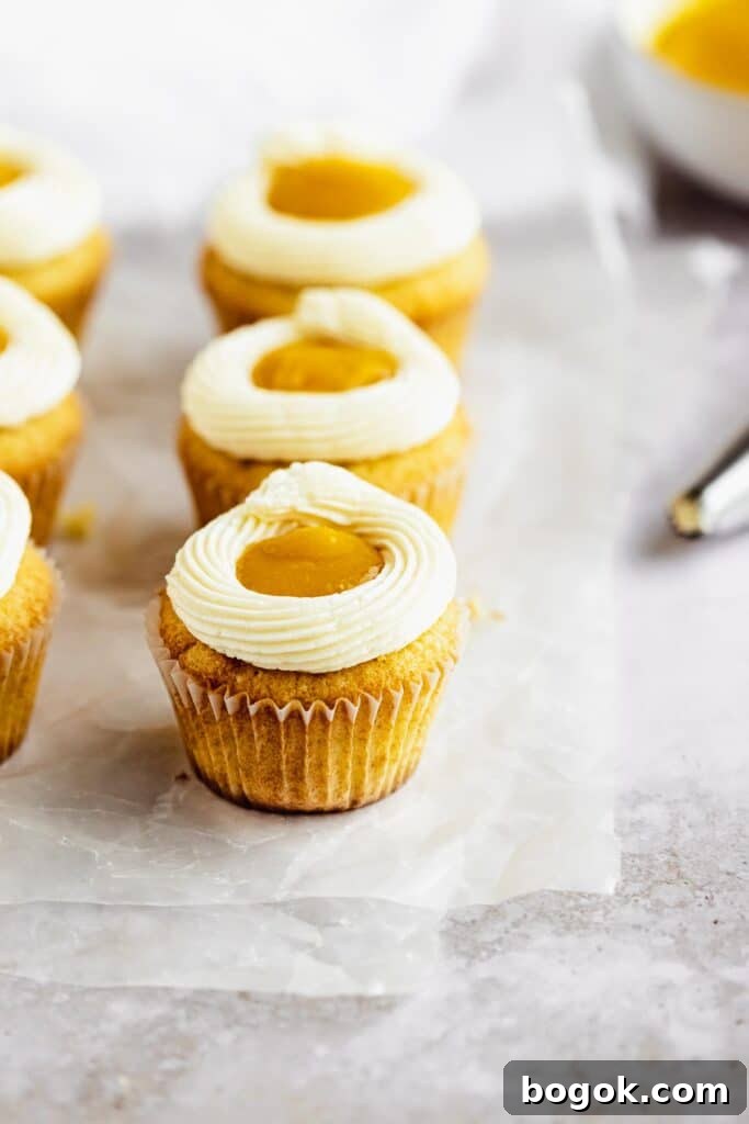 Mango Cupcakes with Luscious Mango Filling 2 decorated mango cupcakes that look like sunny side up eggs