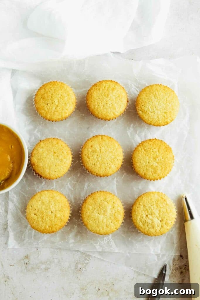 Mango Cupcakes with Luscious Mango Filling 3 the baked vanilla cupcakes ready to fill with mango filling