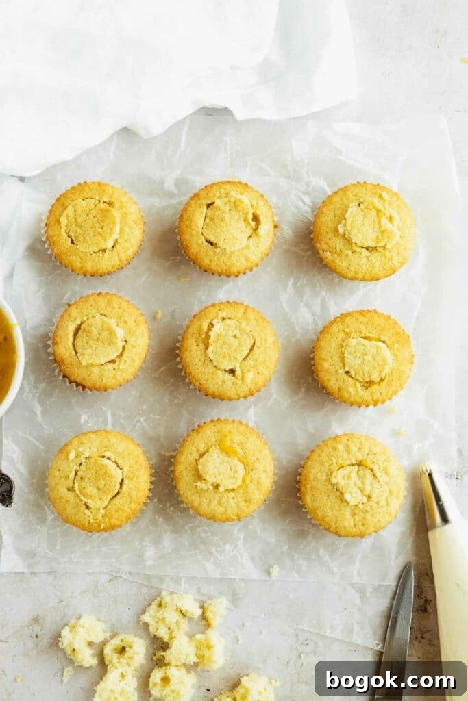 Mango Cupcakes with Luscious Mango Filling 5 sealing the mango cupcakes with cut out pieces of cupcake