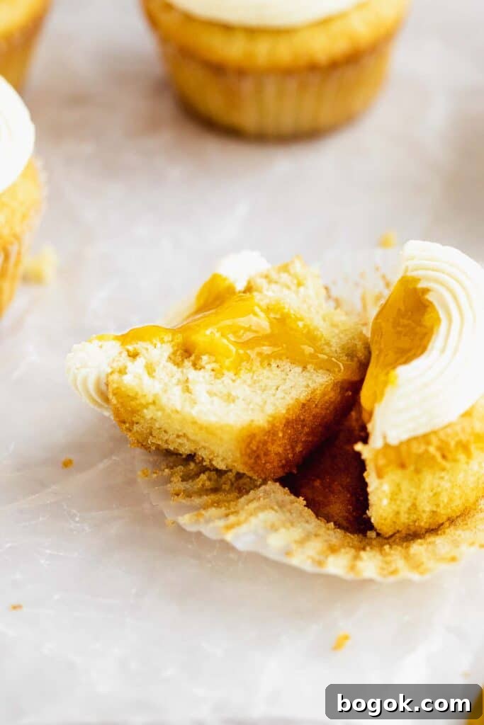 Mango Cupcakes with Luscious Mango Filling 8 cupcake cut open filled with jammy mango filling