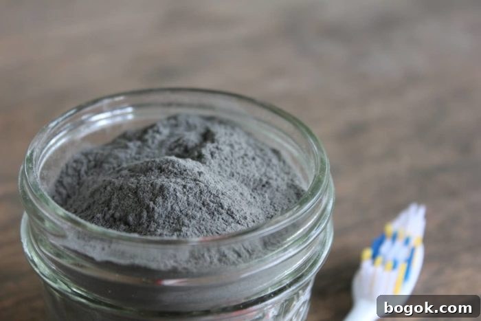 15 DIY Skincare Products You Can Make at Home to Cut Costs 4 Image shows a jar of powder toothpaste next to a toothbrush