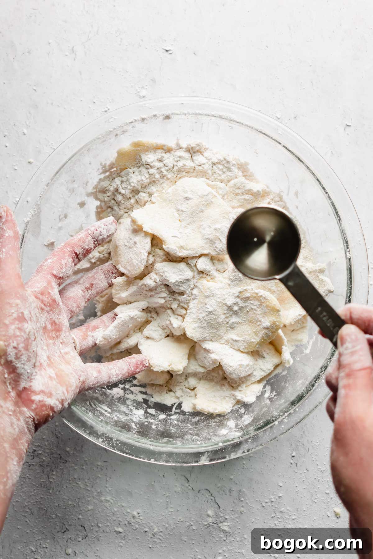 A tablespoon of water is added to the butter and flour.