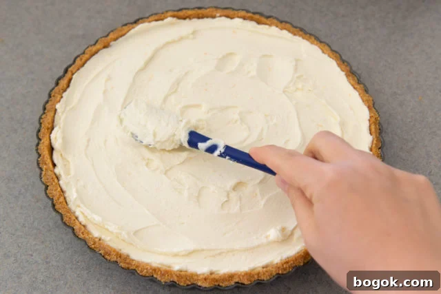 Filling the Graham Cracker Pie Crust with Mascarpone Using Spatula