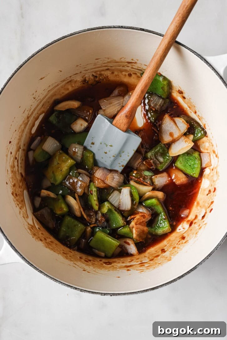 Reduced sauce added to stir fry vegetables.
