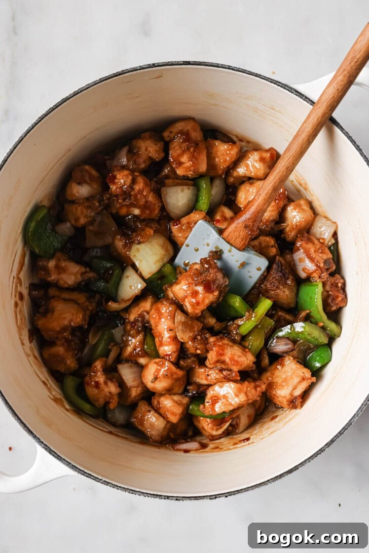 Fried chicken added to stir fry vegetables and sauce.